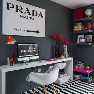 work space home with grey wall white and black stripes on flooring white desk and chair