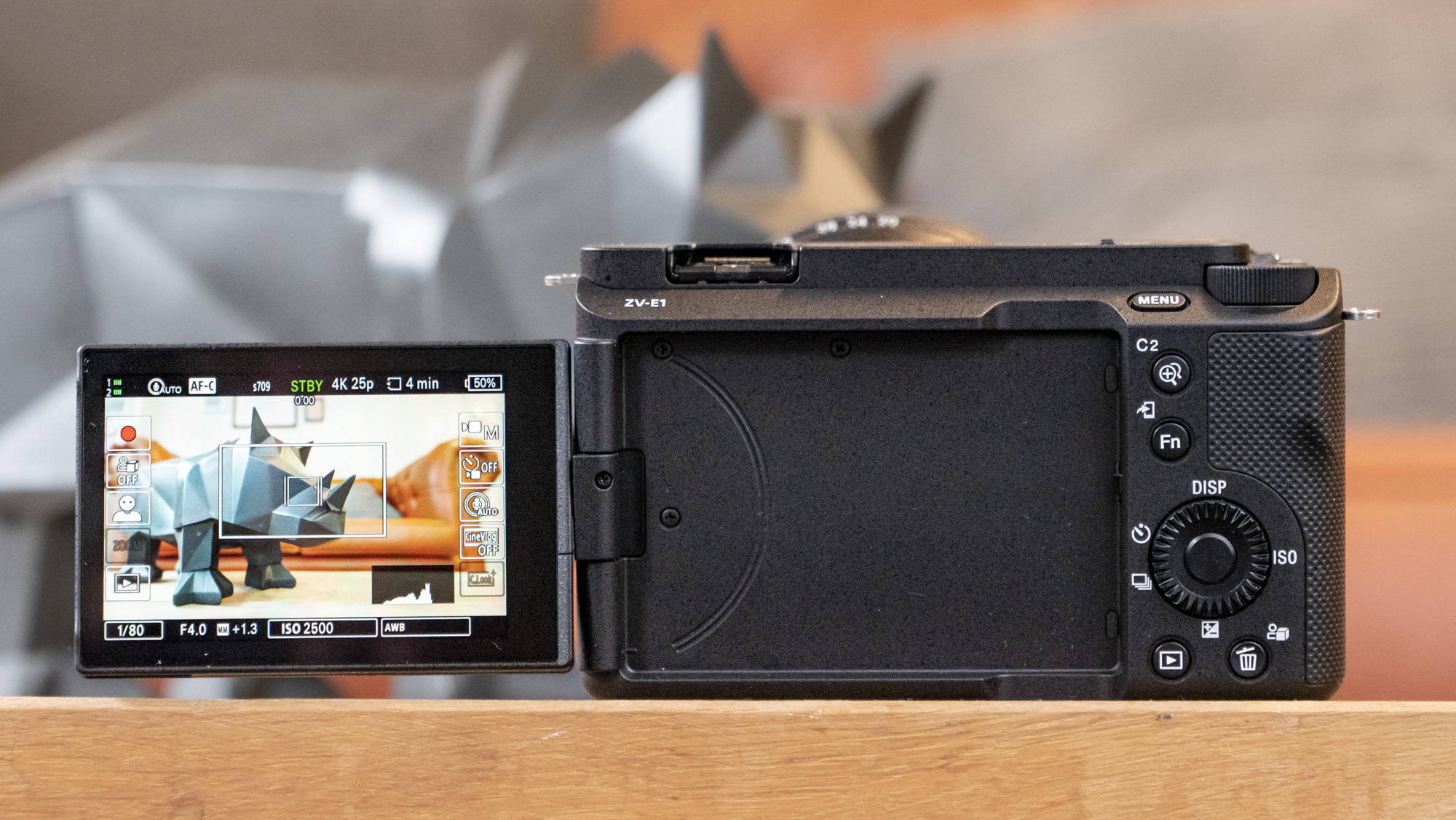 The Sony ZV-E1 camera sitting on a wooden table