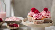 raspberry cupcakes on a cake stand