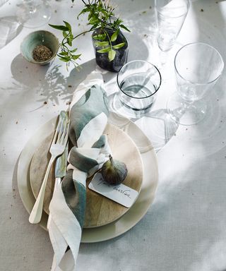 Neutral table setting for French recipes with figs