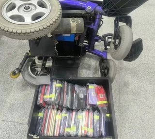 More than a hundred mobile phones hidden inside the battery compartment of an electric wheelchair