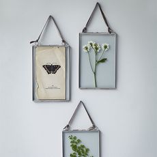 hanging galss frame on white wall