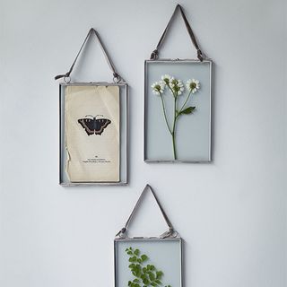 hanging galss frame on white wall