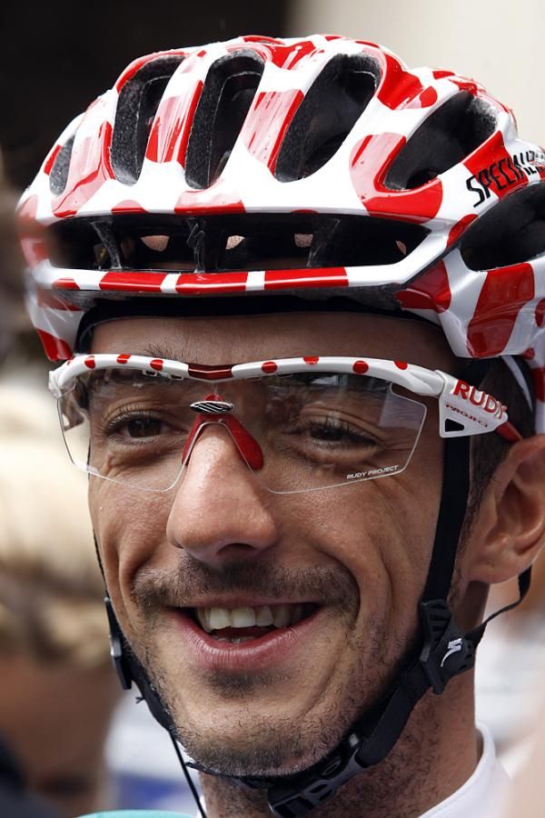 Jelle Vanendert sports a polka dot helmet to match his jersey.