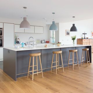 kitchen with wooden flooring and breakfast bar