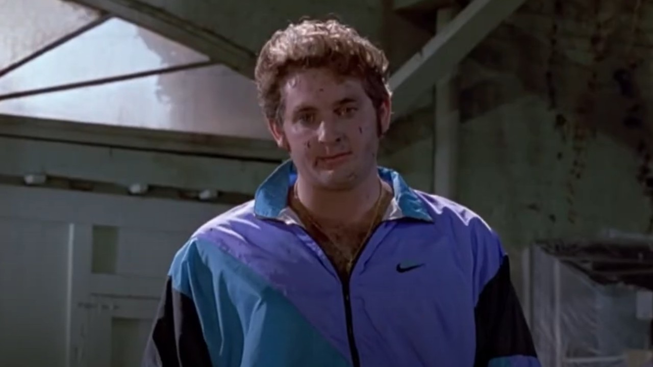 Chris Penn wearing a blue jumpsuit in Reservoir Dogs