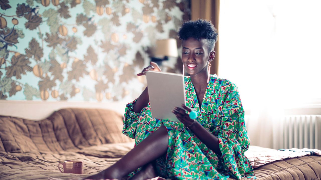 Lady playing on tablet