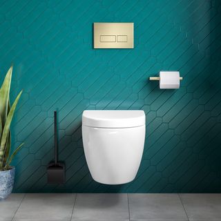 A rimless wall hung toilet against an emerald green tiled wall
