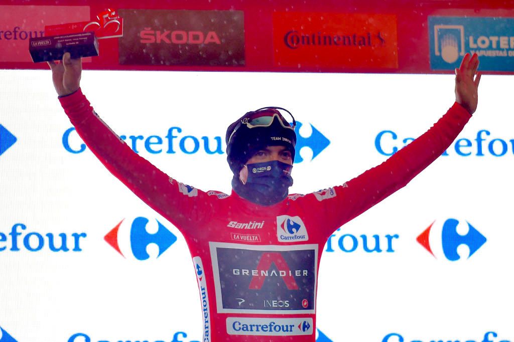 The new overall leader Team Ineos rider Ecuador's Richard Carapaz celebrates on the podium after the 6th stage of the 2020 La Vuelta cycling tour of Spain, a 146,4 km race from Biescas to Formigal, on October 25, 2020. (Photo by ANDER GILLENEA / AFP) (Photo by ANDER GILLENEA/AFP via Getty Images)