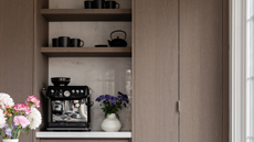 a sleek coffee bar with built in shelves