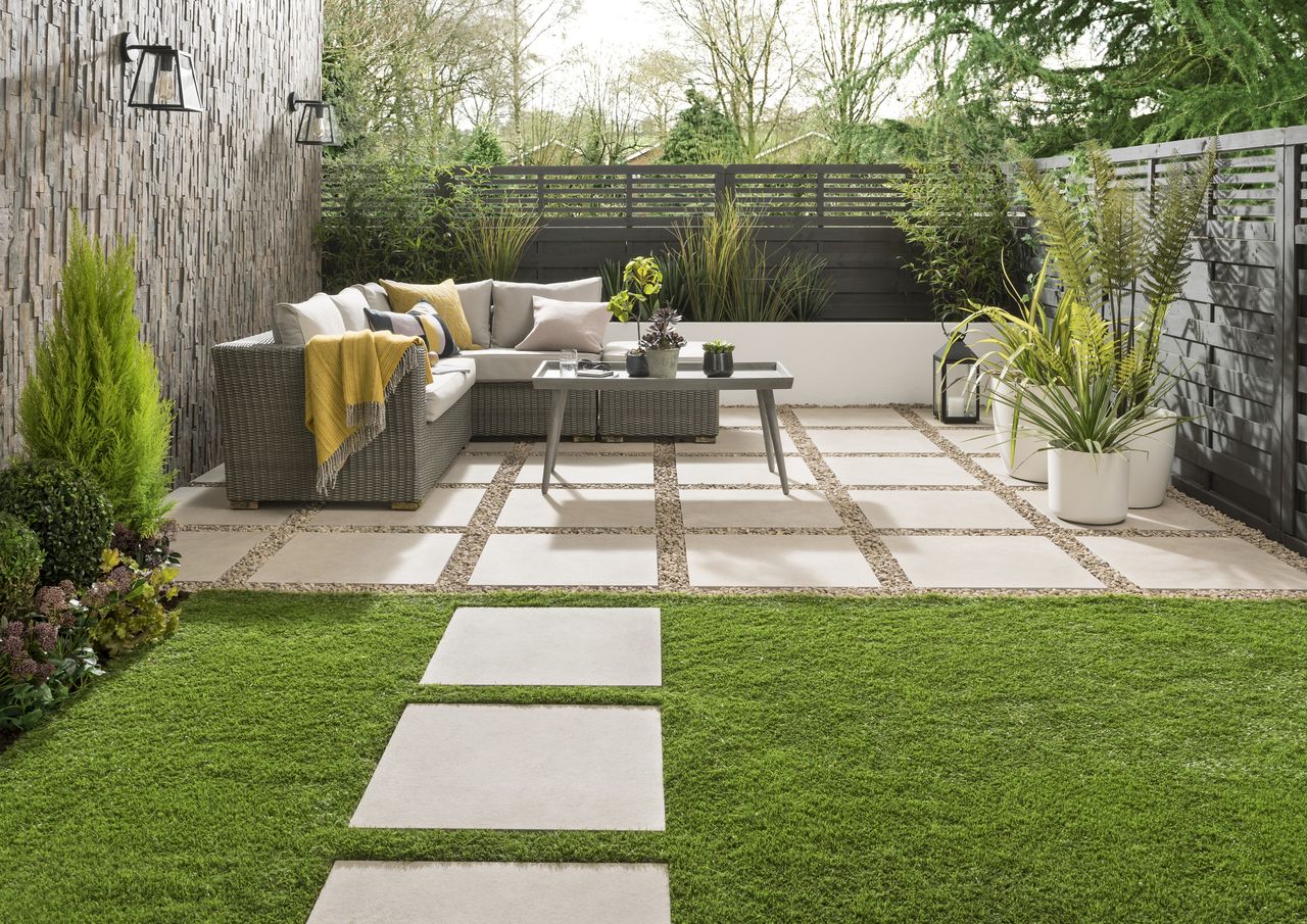 paved patio area with a corner sofa