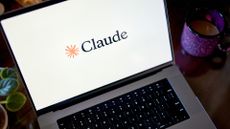 Logo and branding for Claude Code, developed by Ai company Anthropic, pictured on a laptop screen.