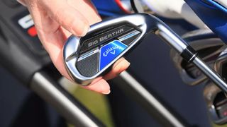 The shiny Callaway Big Bertha Reva Irons being pulled from a bag