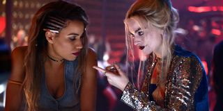 Jurnee Smollett and Margot Robbie as Black Canary and Harley Quinn at a bar in Birds of Prey