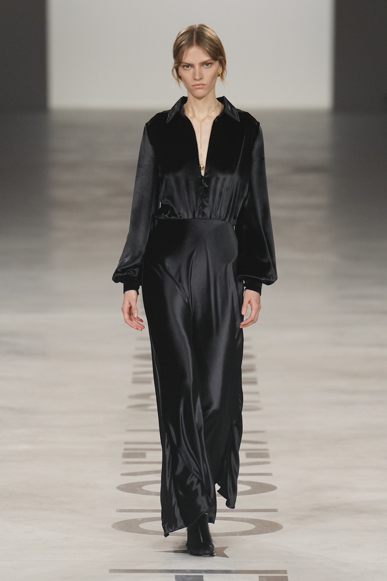 a model wearing a fendi shirt dress