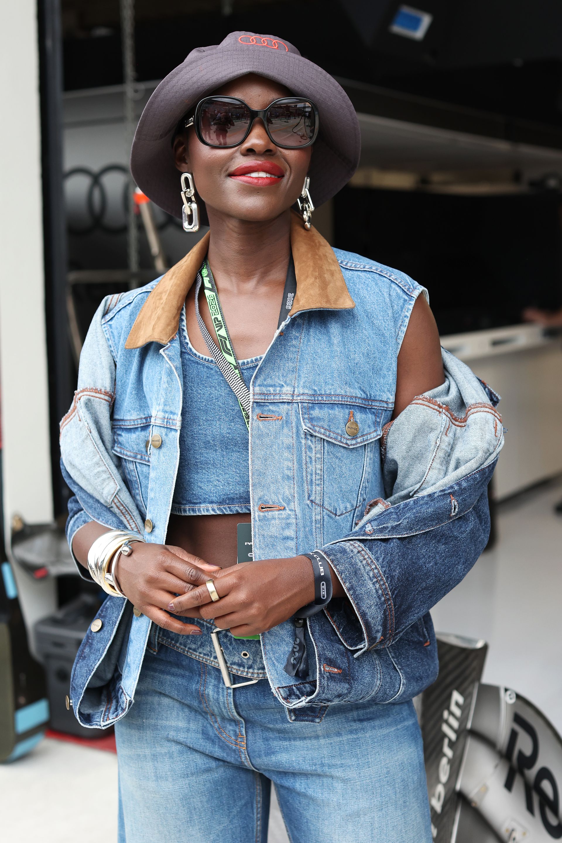 MIAMI, FLORIDA - MAY 03: Lupita Nyong'o poses for a photo in front of the Audi F1 Team garage prior to the F1 Grand Prix of Miami at Miami International Autodrome on May 03, 2026 in Miami, Florida. (Photo by John Phillips/LAT Images)