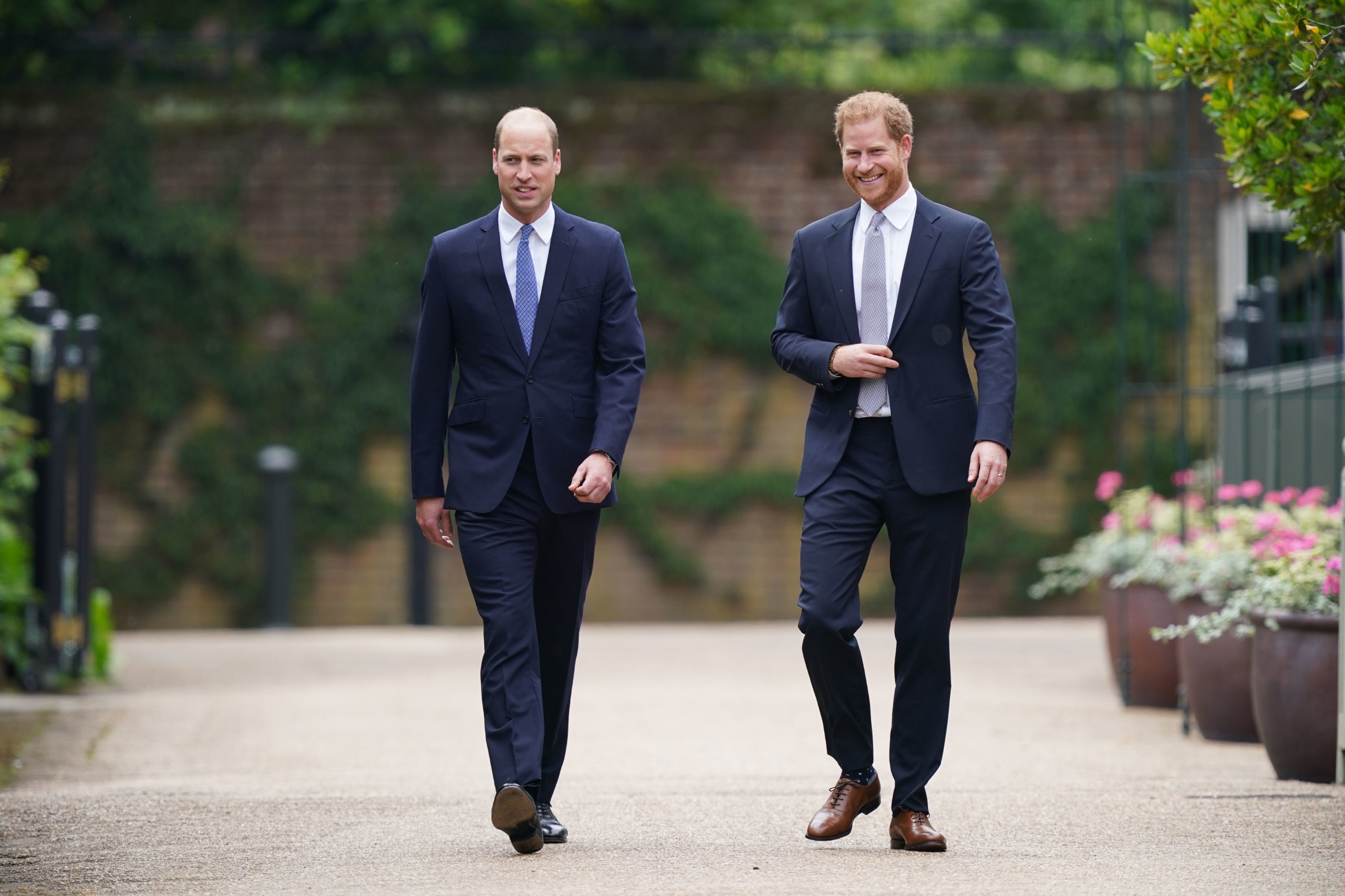 Prince William and Prince Harry walking at the Kensington Palace gardens