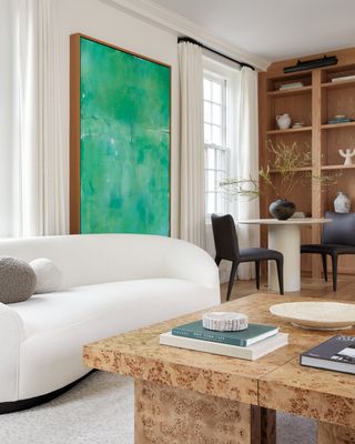 Neutral living room with green artwork