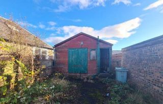 The scout hut that will be torn down and replaced with an unusual home