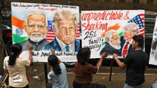 Children in India draw posters about U.S.-India relations under President Donald Trump