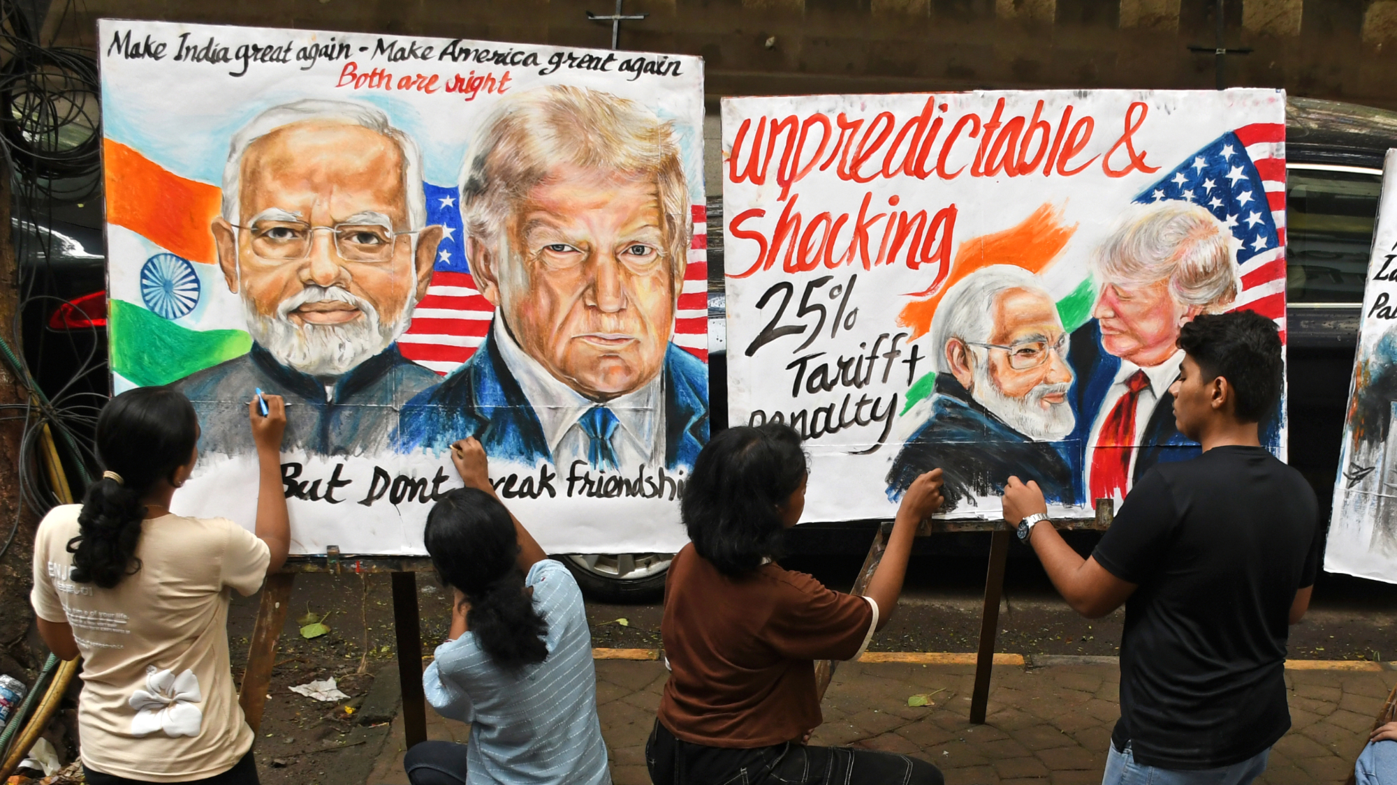 Children in India draw posters about U.S.-India relations under President Donald Trump