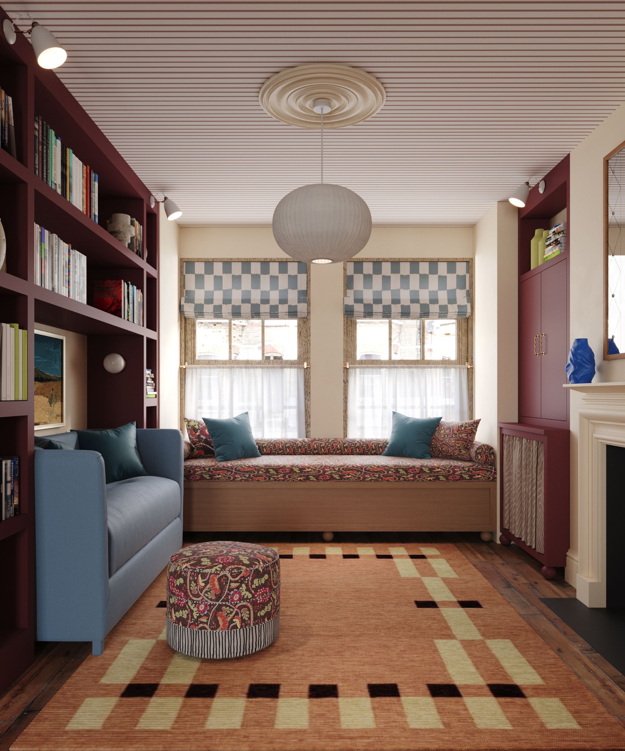 Living room with burgundy painted bookcases, a geometric peach rug, a built-in day bed, and blue loveseat