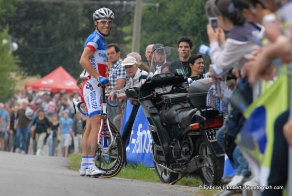 Puncture for Chavanel as he considers jumping on the motorbike.