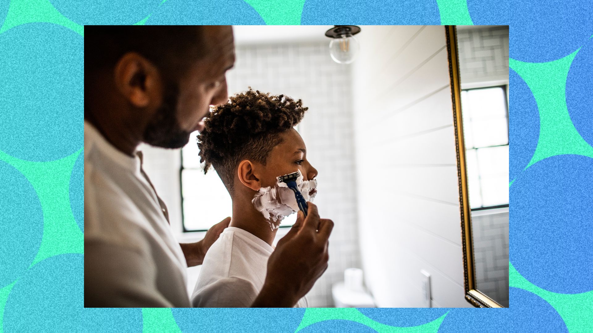 A man teaching a son to shave 