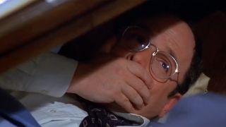 George under his desk in Seinfeld