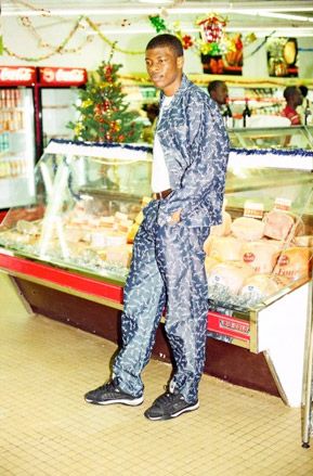 African male wearing patterned clothes in supermarket