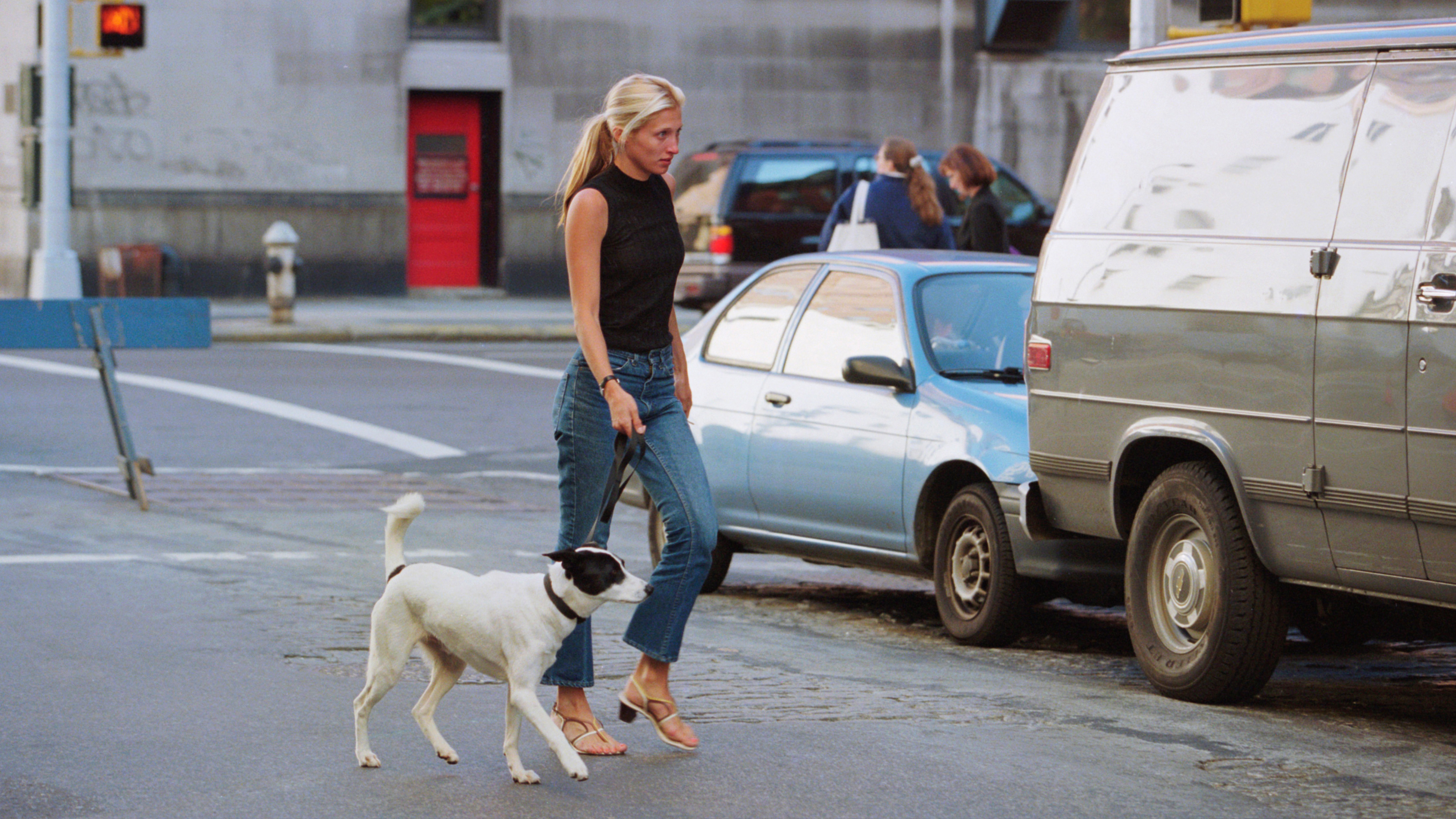 Carolyn Bessette Kennedy wearing jeans and a black tank.