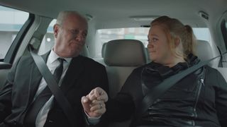 Charlie and Robyn hold hands as they're driven to Duffy's funeral