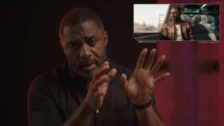 Idris Elba speaks to the camera while a smaller version fo the Cyberpunk: Phantom Liberty trailer plays in the corner.