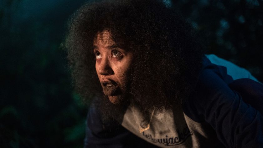 Jasmin Savoy Brown as Taissa eating dirt in the woods during Yellowjackets Season 1, episode 6