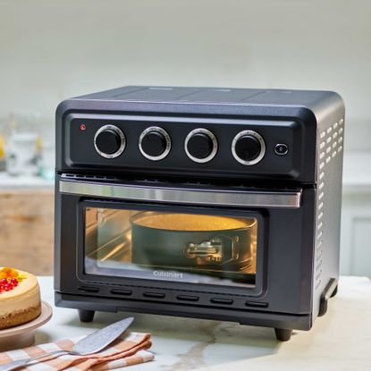 Cheesecake being cooked in air fryer oven