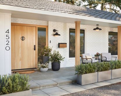 a porch with outdoor lighting