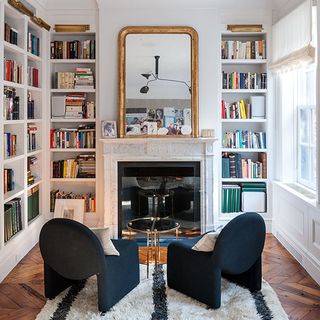 study room with open book shelve and mirror on wall