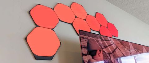 Nanoleaf Shapes Ultra Black Hexagons over TV, orange.