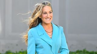 Sarah Jessica Parker with long highlighted hair in a blue suit