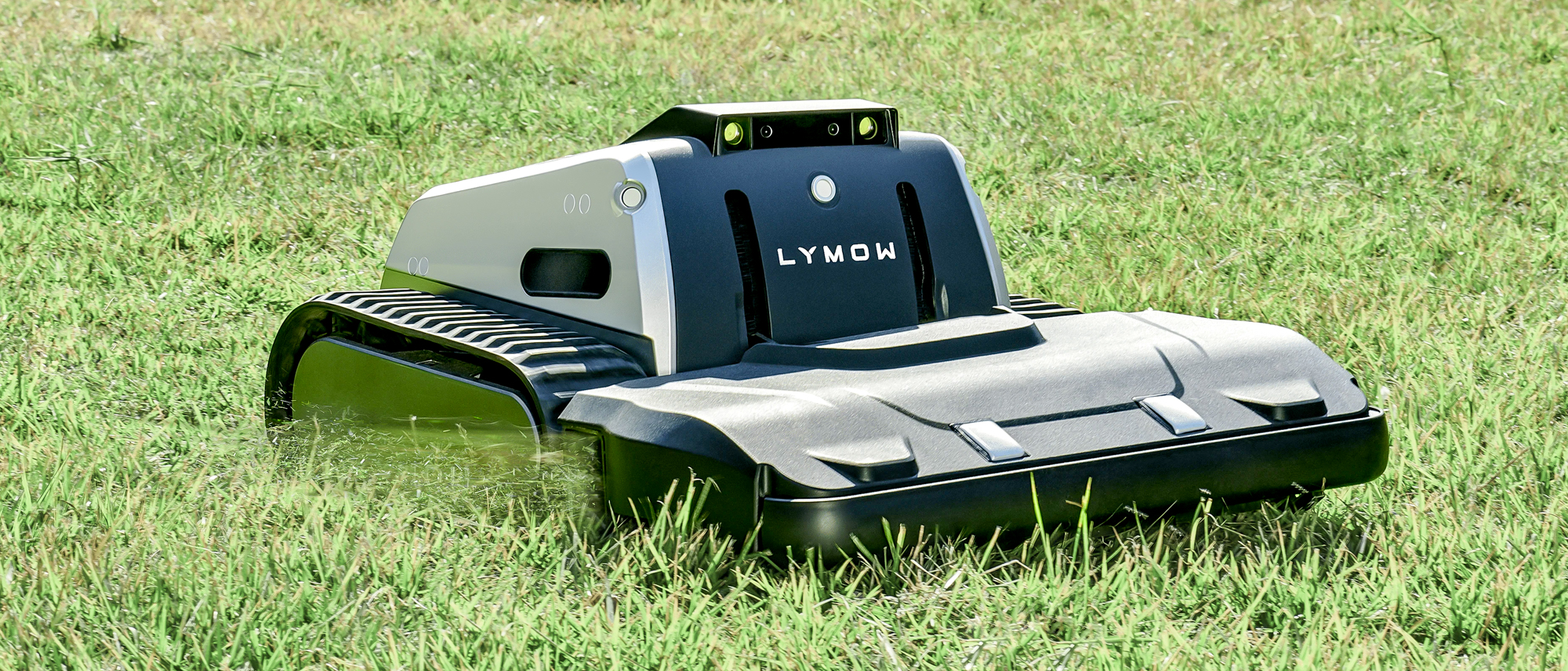 Lymow One Plus robot mower on a lawn