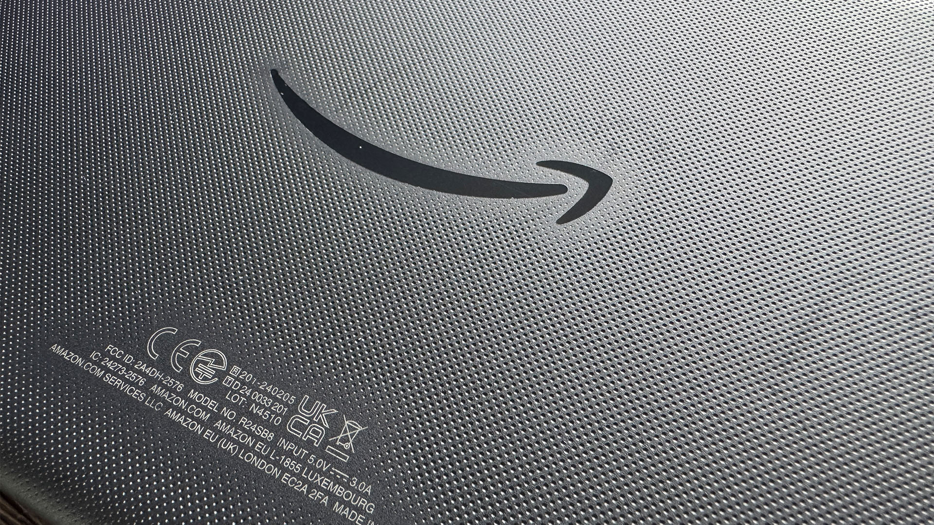 Amazon Fire HD 8 tablet detail of Amazon arrow on back of device