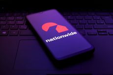 The Nationwide Building Society logo appears on the screen of a smartphone