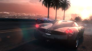 Two cars driving against a sunset in The Crew.