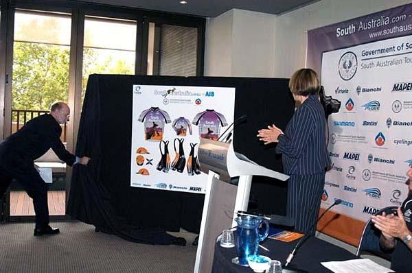 The Hon. Jane Lomax-Smith, Minister for South Australian Tourism, unveils the striking team apparel for the SouthAustralia.com - AIS Cycling Team, with the assistance of Cycling Australia CEO Graham Fredericks.
