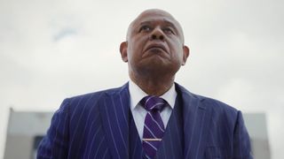 Forest Whitaker as Bumpy Johnson in a blue suit in Godfather of Harlem season 4
