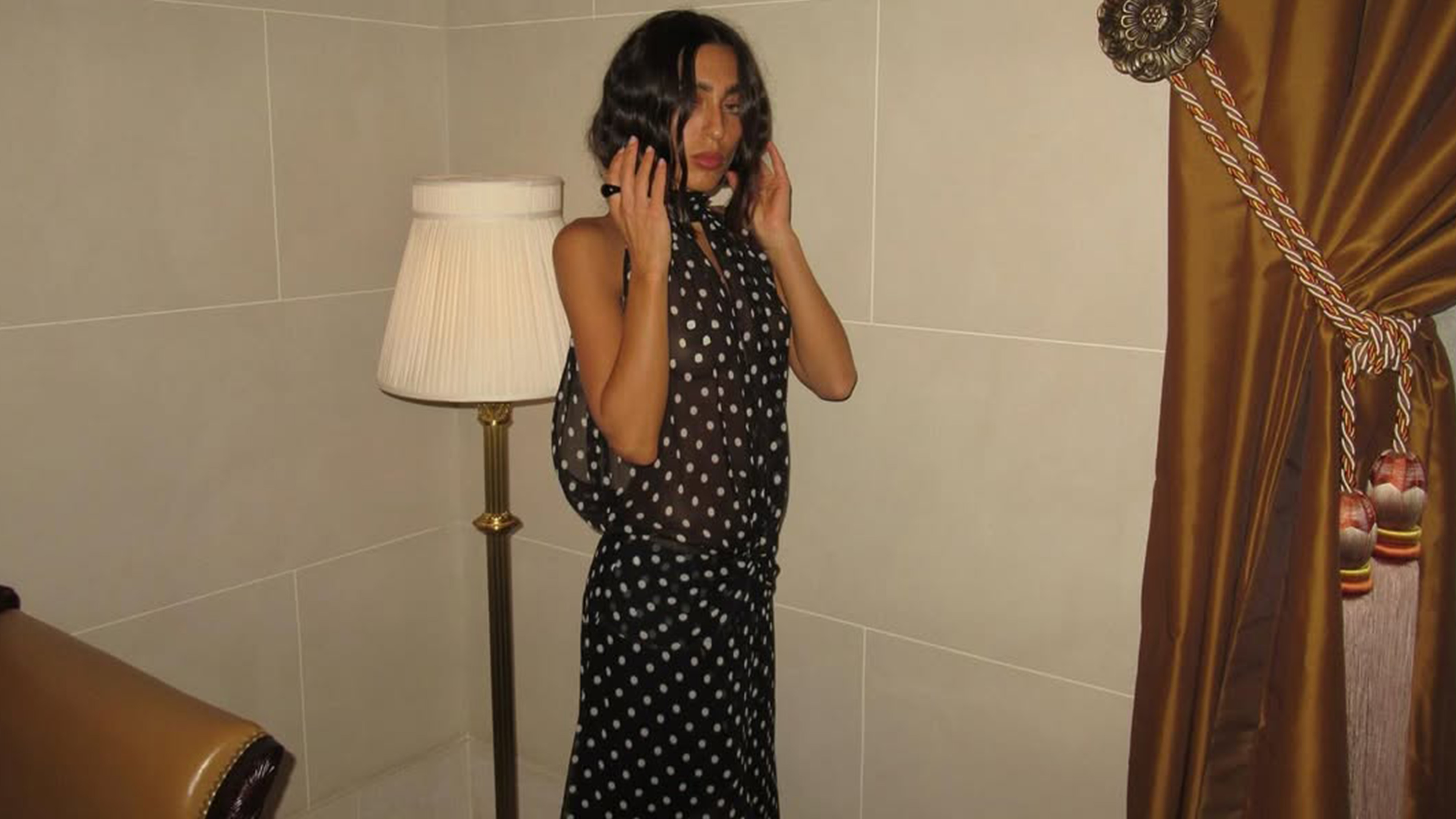 Camelia Farhoodi in a polka dot dress.