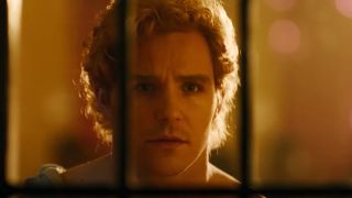 A college student looking through a door in True Haunting