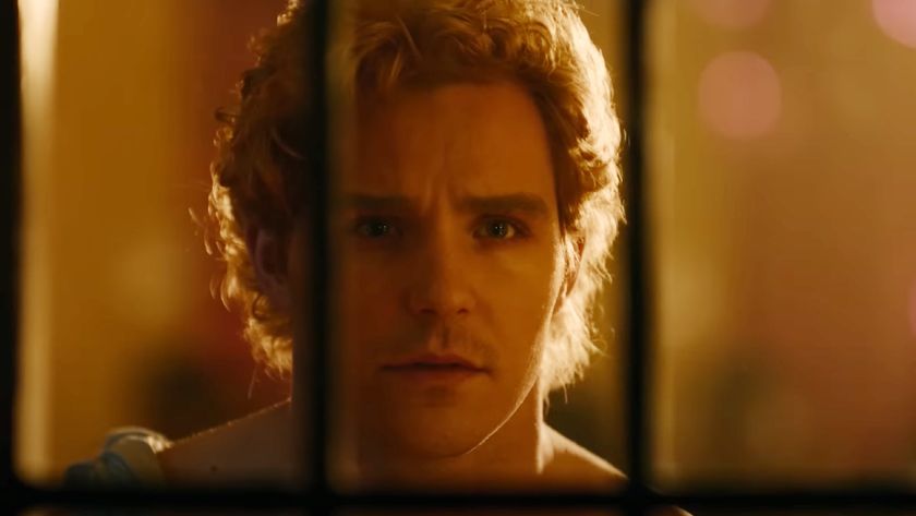 A college student looking through a door in True Haunting