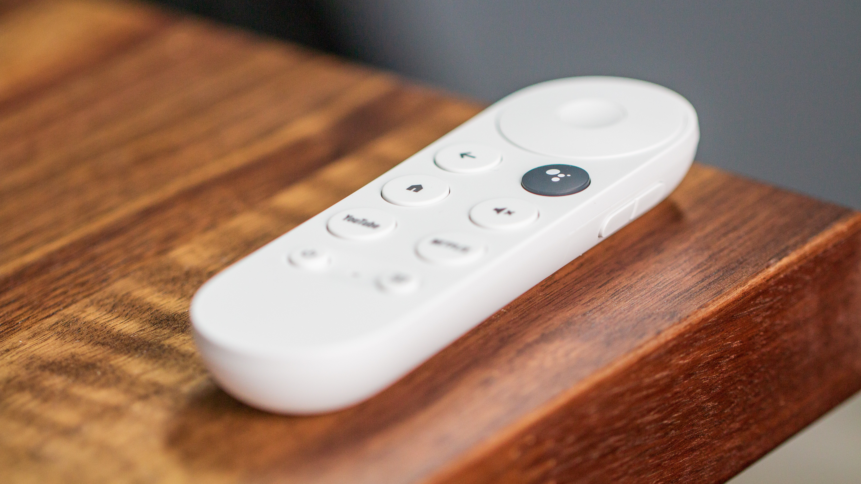 Chromecast with Google TV HD remote on table