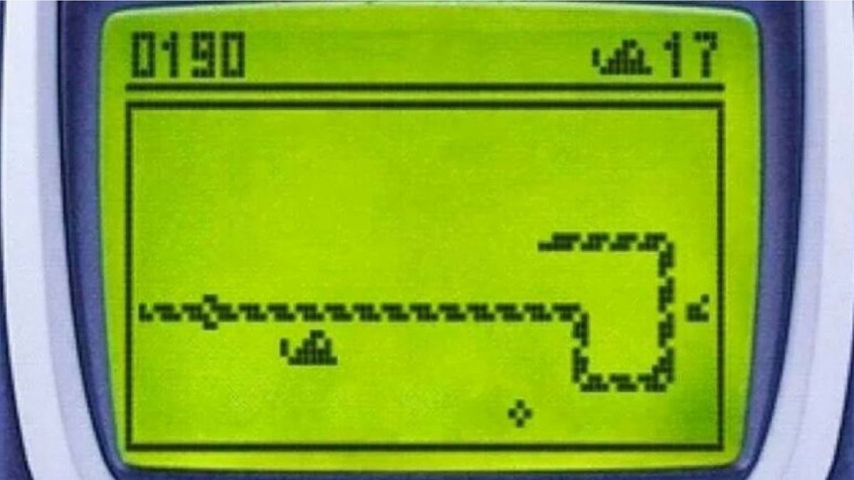 A person plays the classic mobile game Snake as the new Nokia 3310